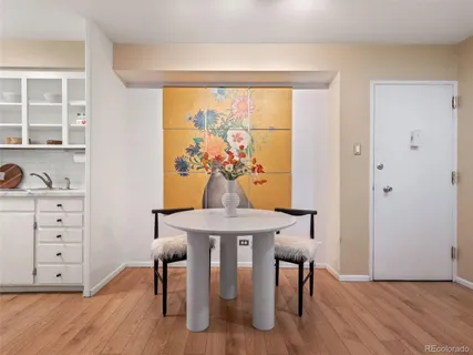 a view of a dining room with furniture window and wooden floor