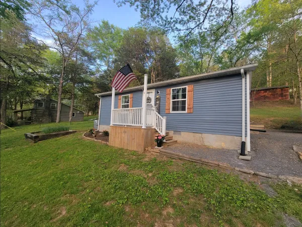 a backyard of a house with lots of green space