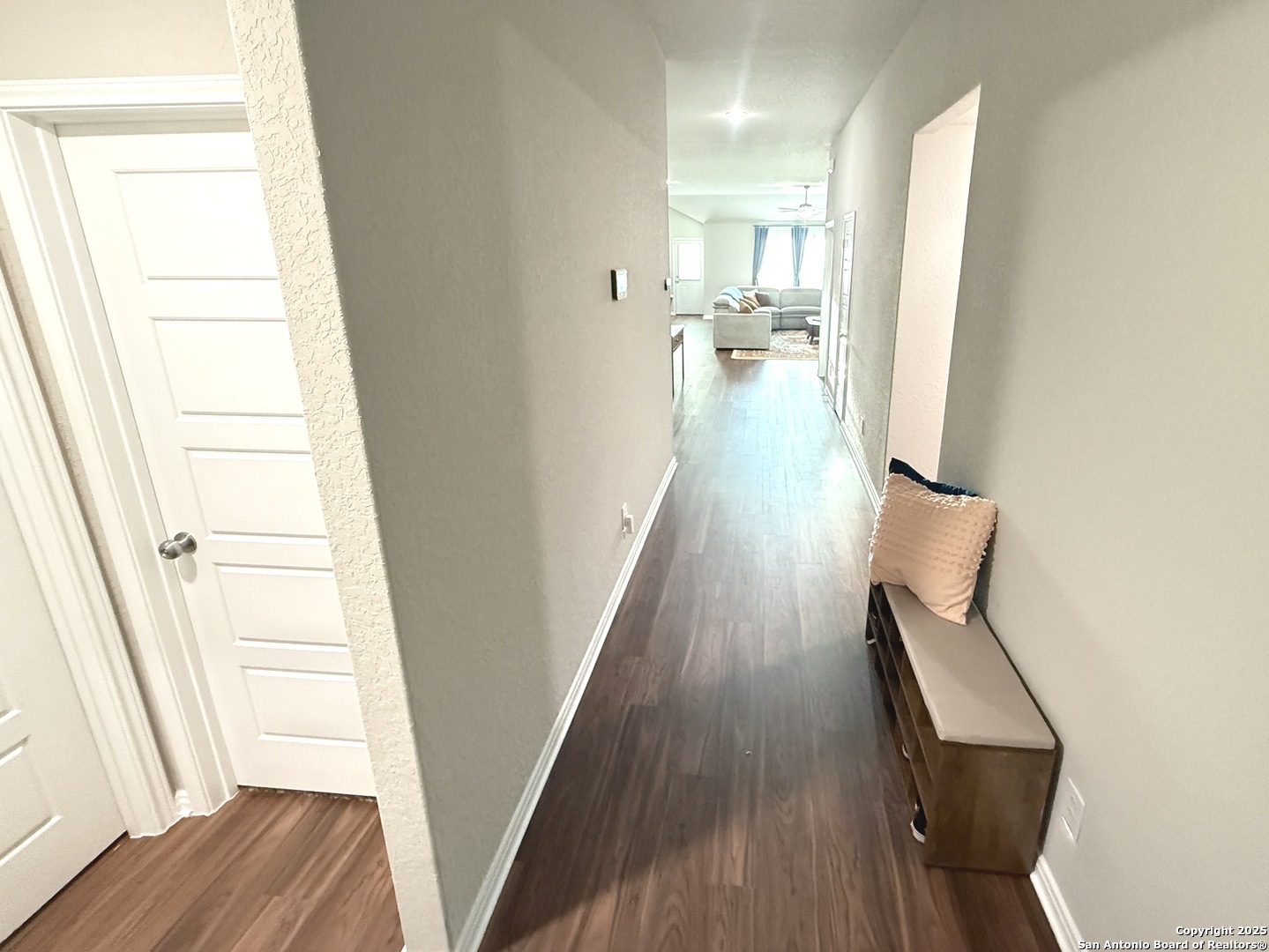 20929 Pleasanton Road San Antonio, TX 78264 - Photo 27 of 51 a view of a hallway with wooden floor and staircase