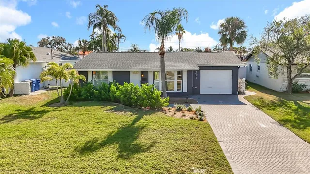 a view of house with yard