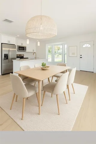 a view of a dining room with furniture