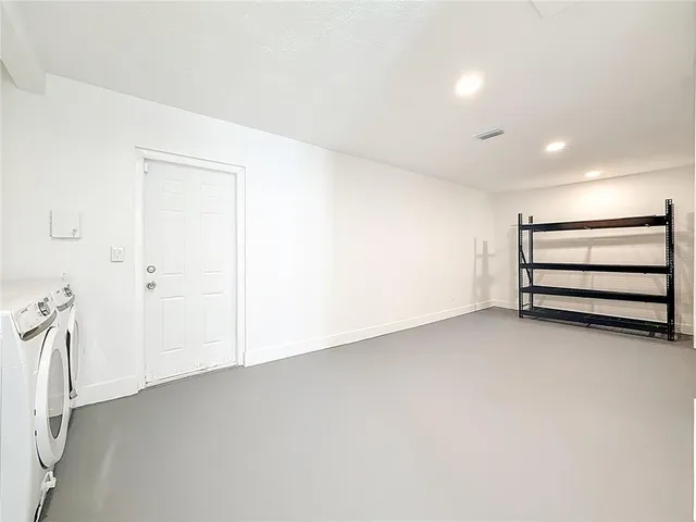 an empty room with a bench