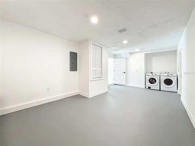 an empty room with windows and view