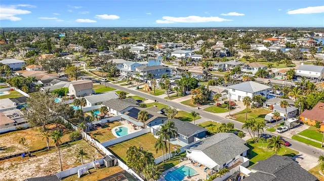 aerial view of a house with a yard