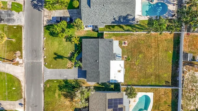 an aerial view of a house with a garden