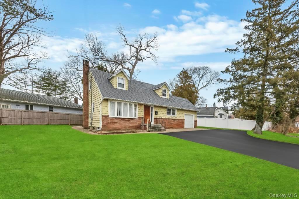 55 Amityville Road Melville, NY 11747 - Photo 3 of 21 a view of a house with a yard porch and sitting area