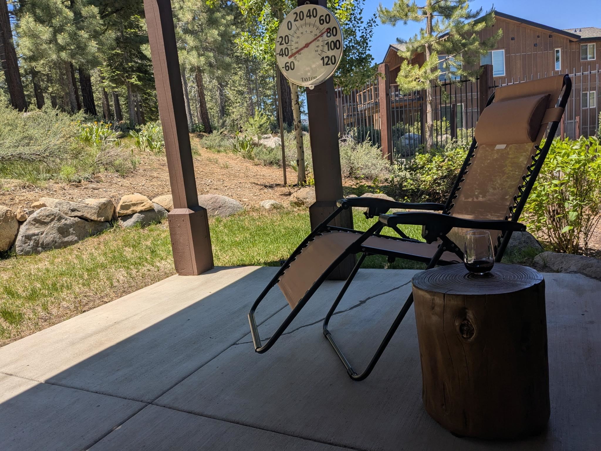 11541 Dolomite Way, Unit 3 Truckee, CA 96161 - Photo 14 of 28 a bench sitting in front of a house with a fountain