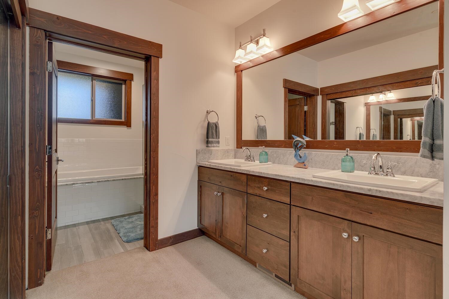 11541 Dolomite Way, Unit 3 Truckee, CA 96161 - Photo 18 of 28 a bathroom with a double vanity sink and a mirror