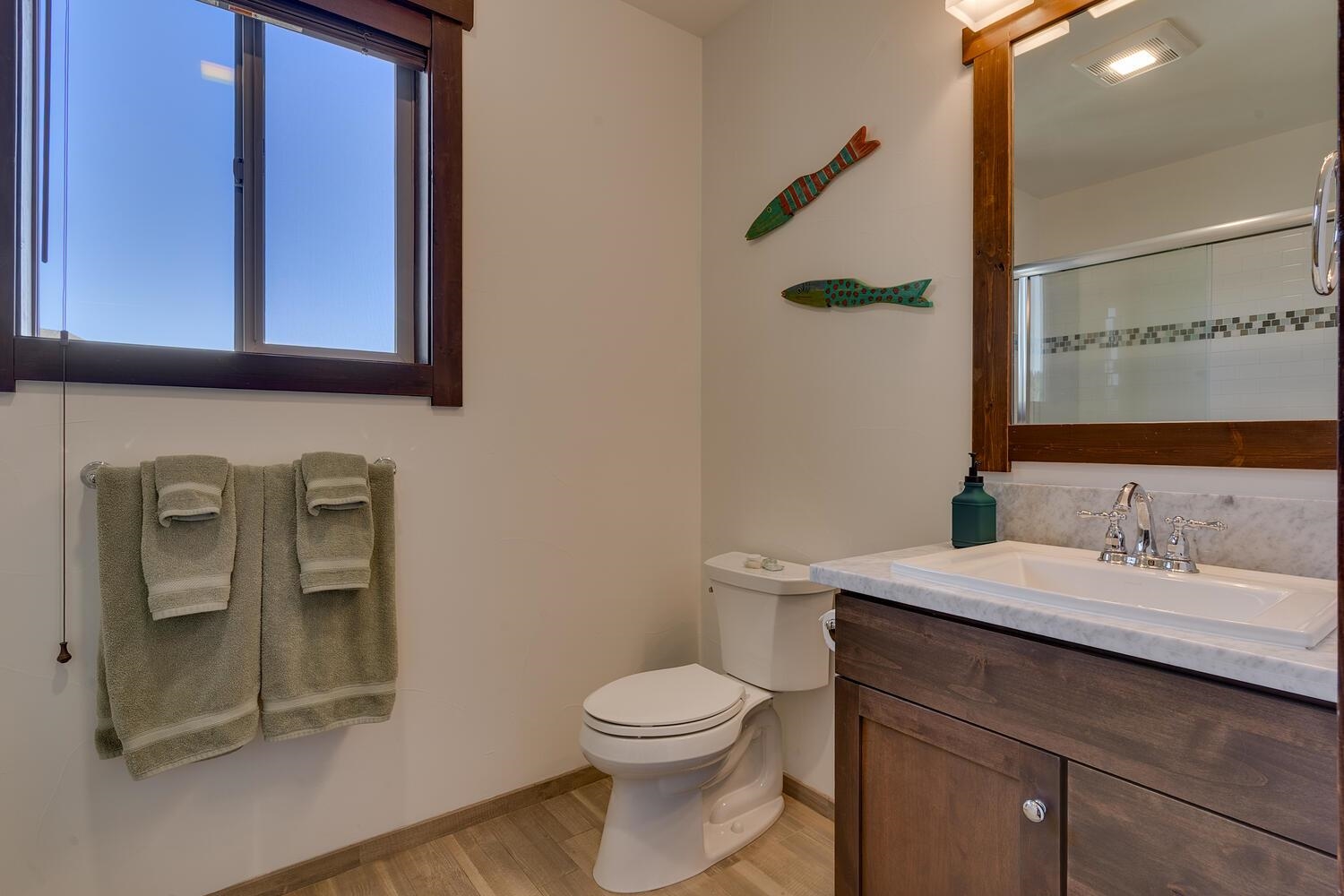 11541 Dolomite Way, Unit 3 Truckee, CA 96161 - Photo 21 of 28 a bathroom with a toilet a sink and mirror