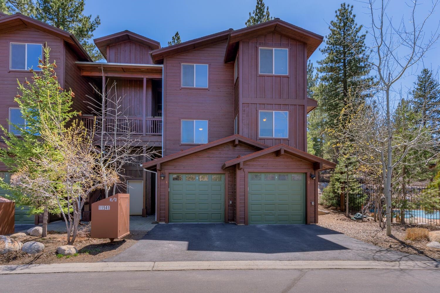 11541 Dolomite Way, Unit 3 Truckee, CA 96161 - Photo 4 of 28 a front view of a house with a yard and garage