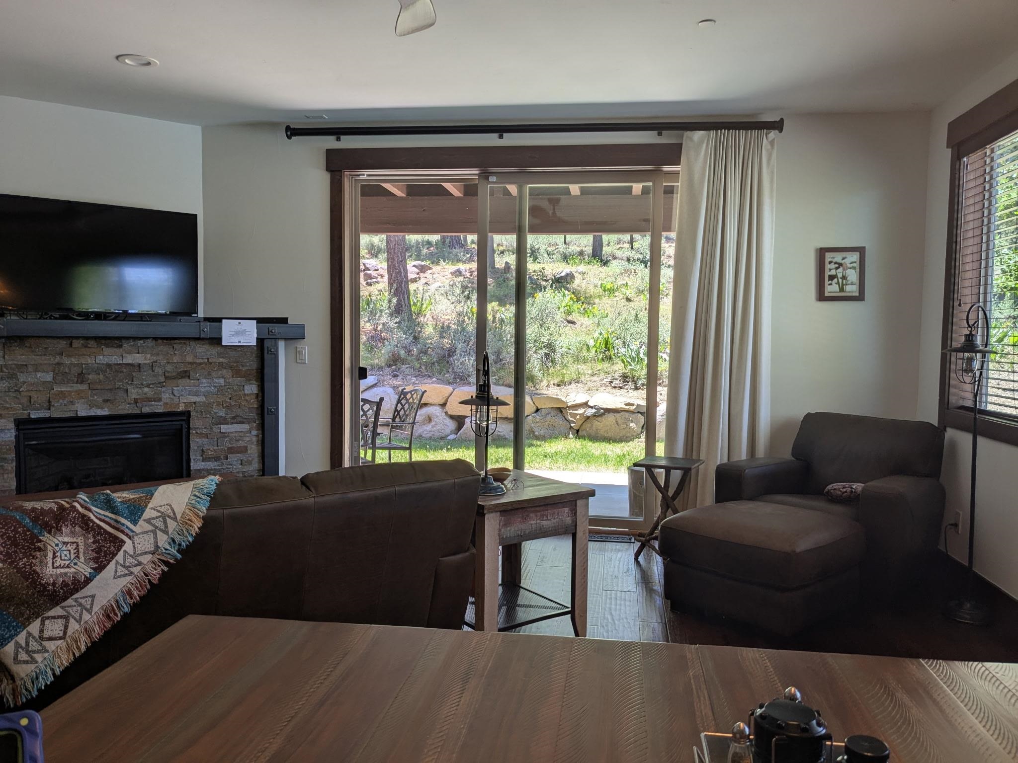 11541 Dolomite Way, Unit 3 Truckee, CA 96161 - Photo 8 of 28 a living room with furniture and a flat screen tv