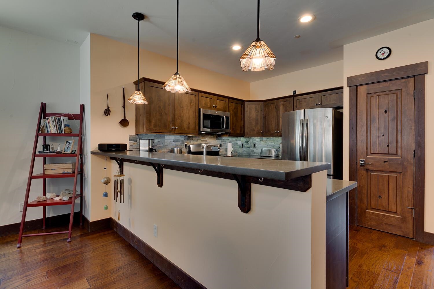 11541 Dolomite Way, Unit 3 Truckee, CA 96161 - Photo 9 of 28 a kitchen with stainless steel appliances a stove center island and a refrigerator