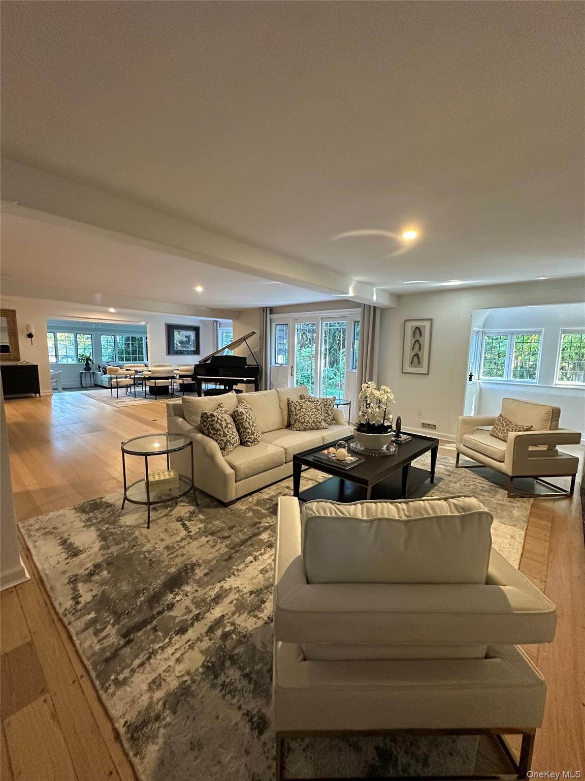 9 Beacon Hill Road Port Washington, NY 11050 - Photo 4 of 4 a living room with furniture and a large window