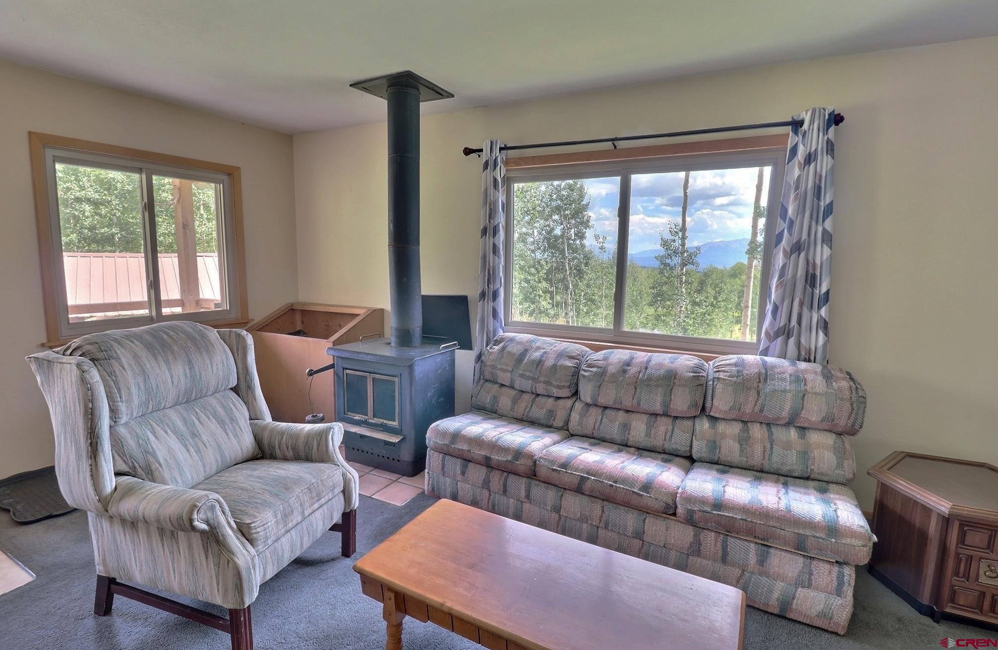 37461 Roatcap Road Paonia, CO 81428 - Photo 4 of 29 a living room with furniture and a large window