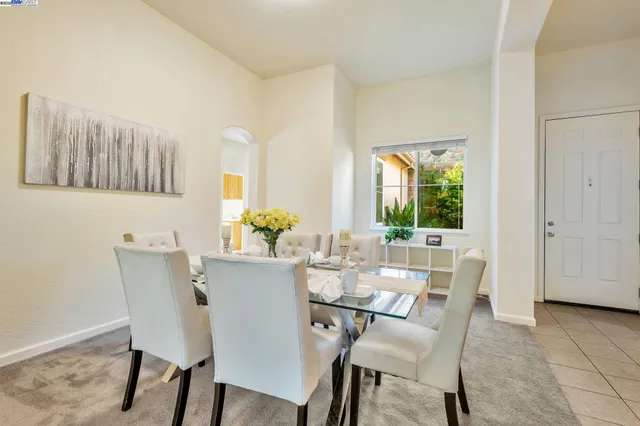 a view of a dining room with furniture and a window