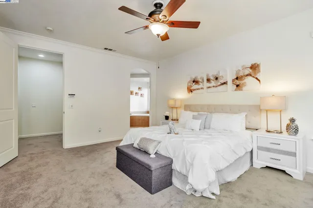 a bedroom with bed and window