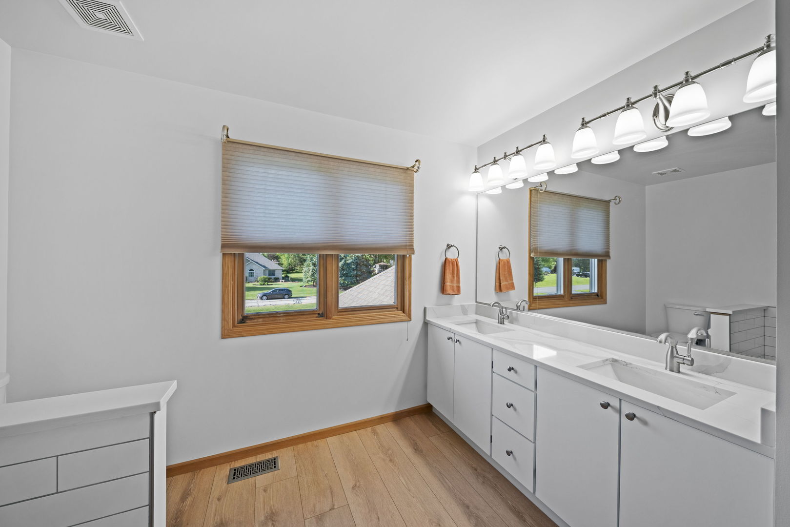 1609 Elm Street Spring Grove, IL 60081 - Photo 15 of 26 a spacious bathroom with a double vanity sink and a mirror