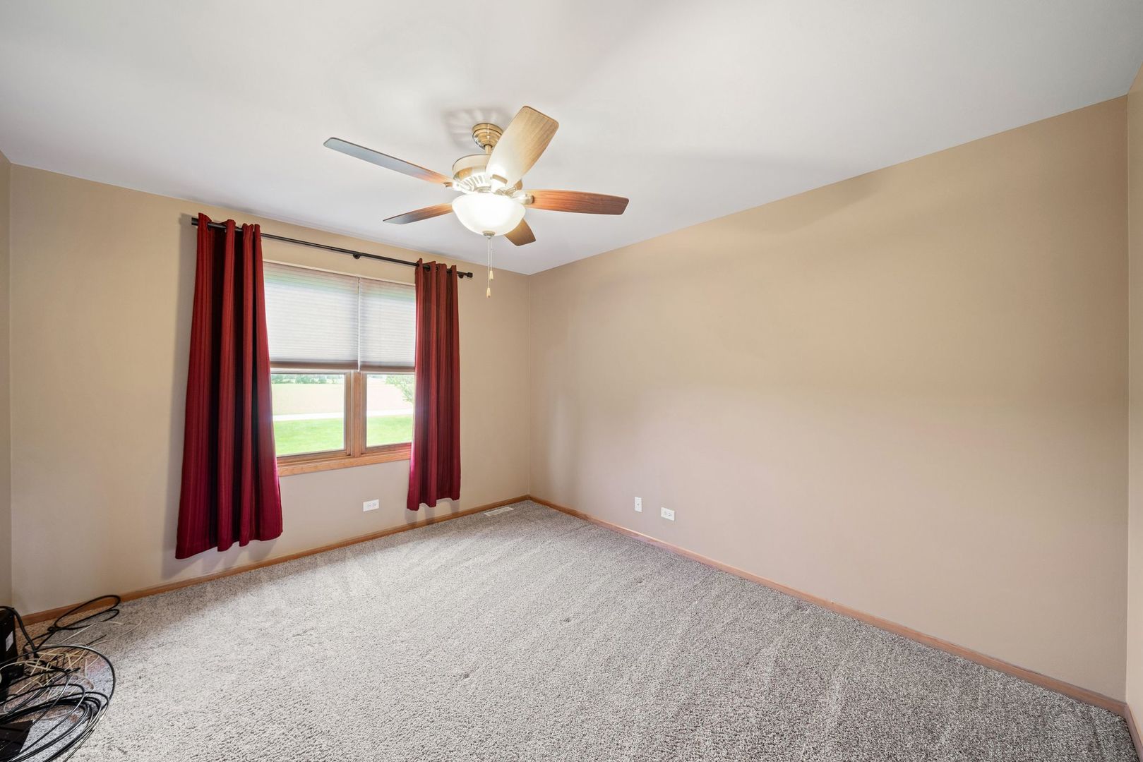 1609 Elm Street Spring Grove, IL 60081 - Photo 18 of 26 an empty room with windows and fan