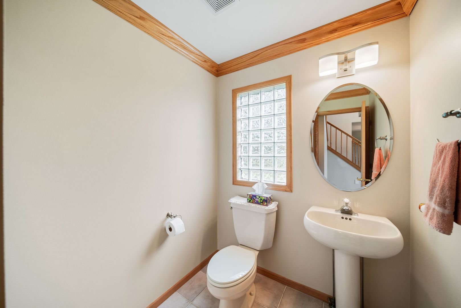 1609 Elm Street Spring Grove, IL 60081 - Photo 5 of 26 a bathroom with a toilet a sink and mirror