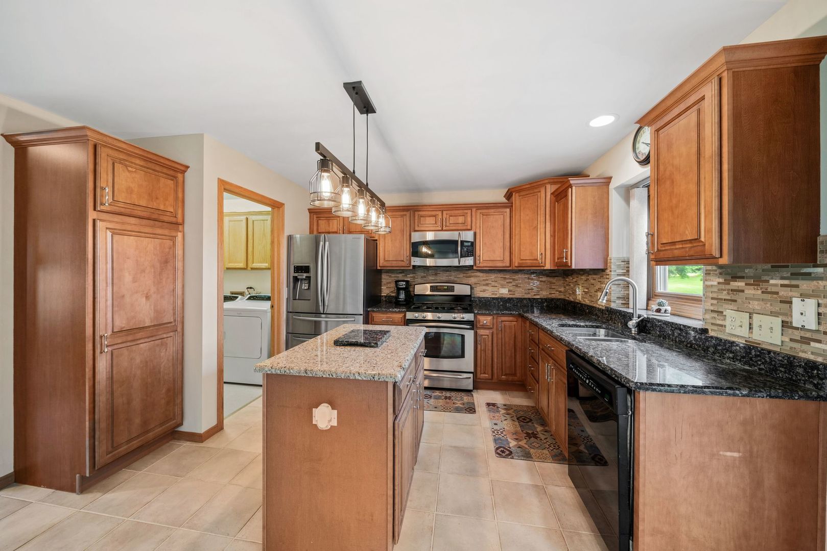 1609 Elm Street Spring Grove, IL 60081 - Photo 9 of 26 a kitchen with stainless steel appliances granite countertop a refrigerator a stove top oven a sink and dishwasher