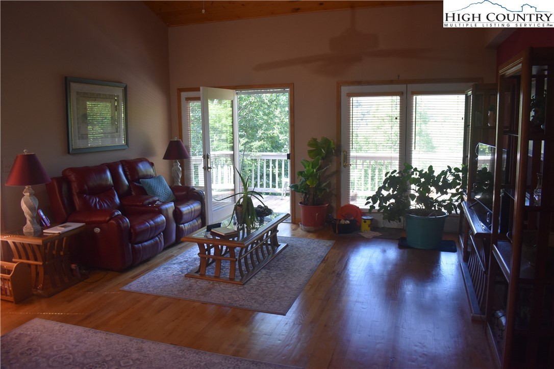 592 River Hills Road Lansing, NC 28643 - Photo 14 of 36 a living room with furniture and a large window