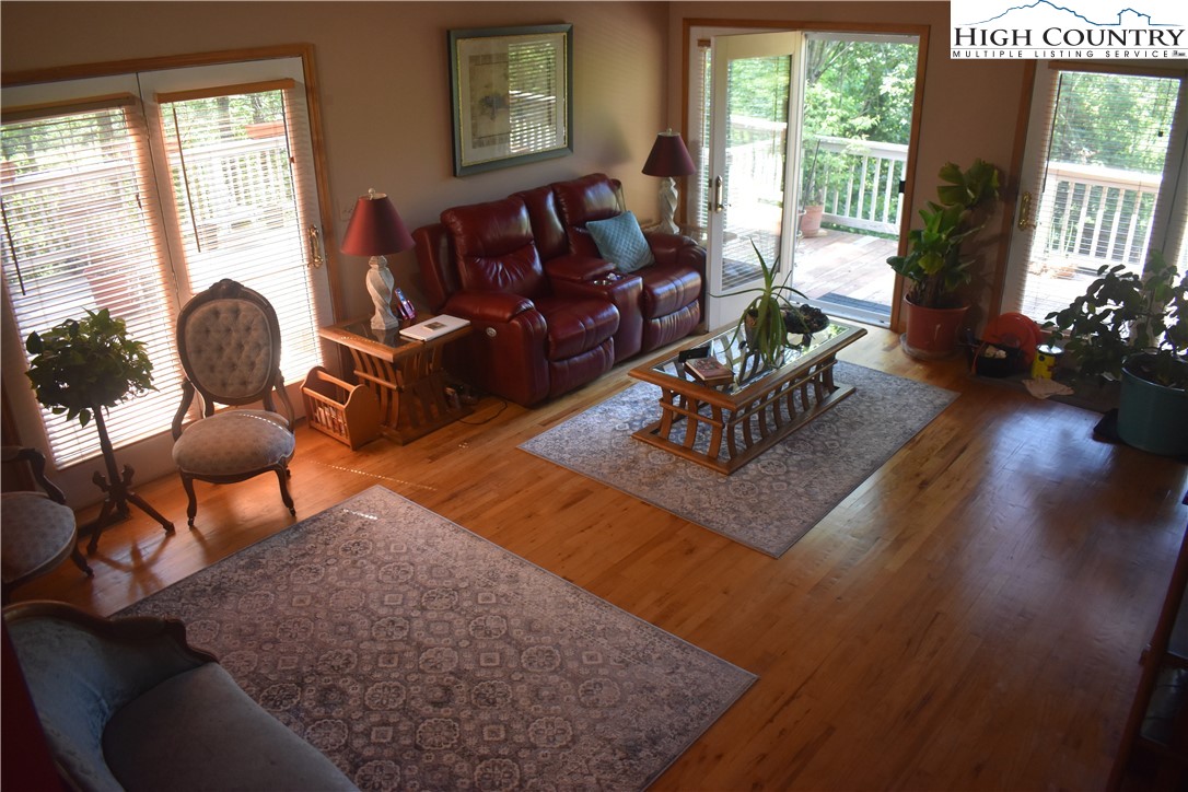 592 River Hills Road Lansing, NC 28643 - Photo 18 of 36 a living room with furniture rug and wooden floor