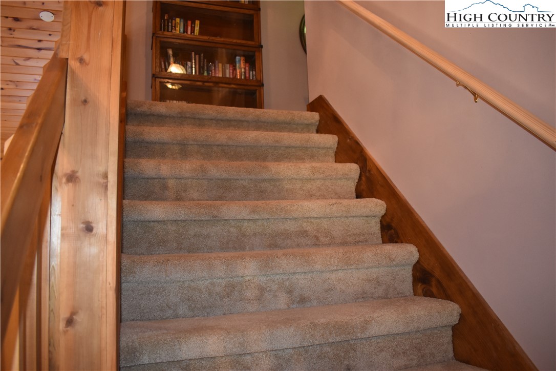 592 River Hills Road Lansing, NC 28643 - Photo 27 of 36 a view of staircase with white walls