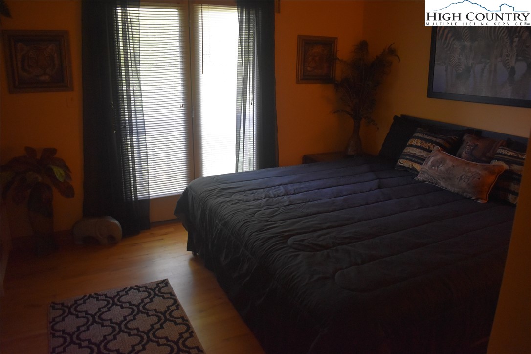 592 River Hills Road Lansing, NC 28643 - Photo 31 of 36 a bedroom with a bed and a window
