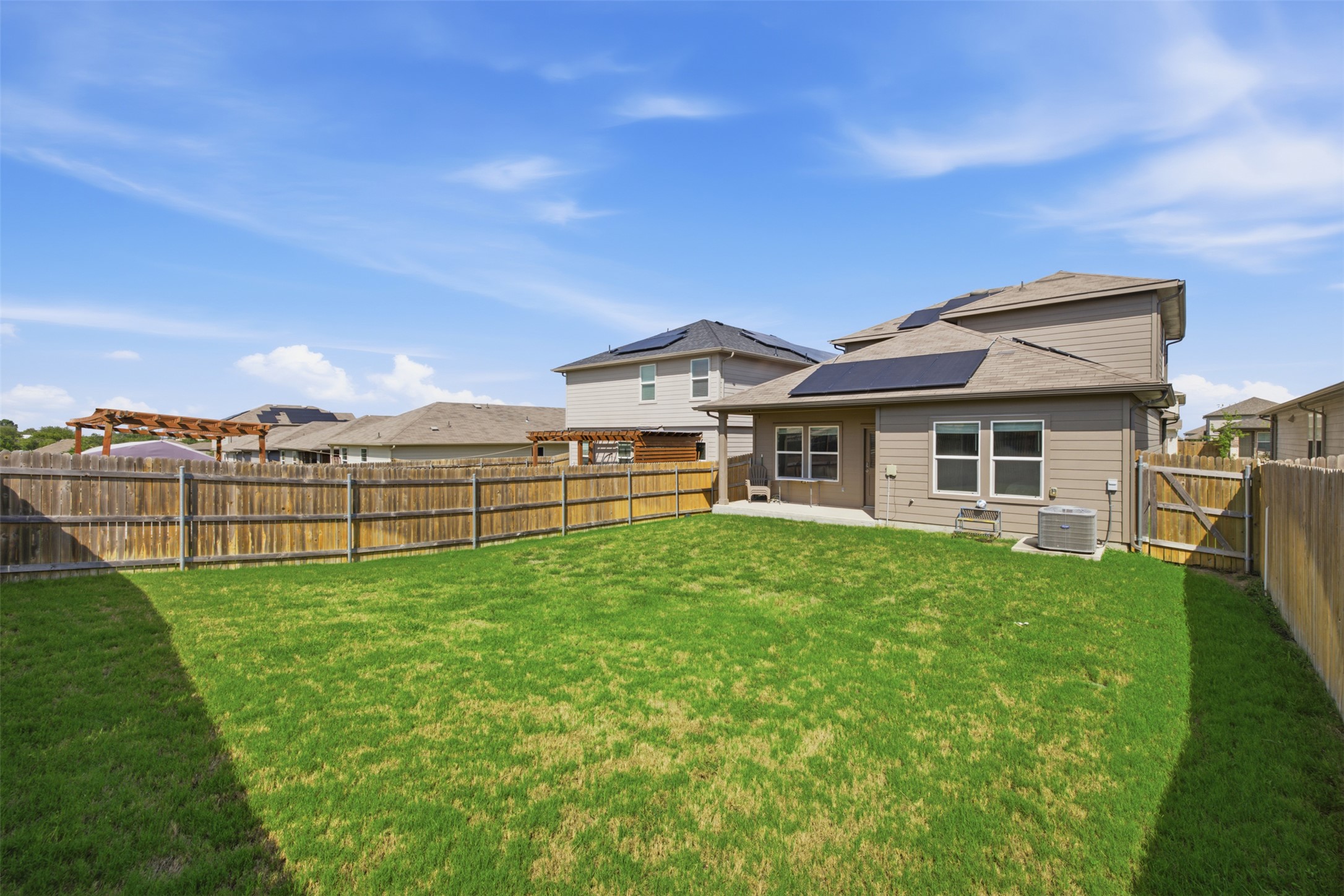 15000 Bajada Rd Manor Manor, TX 78653 - Photo 27 of 31 A spacious, enclosed backyard offers ample green space and a private setting.