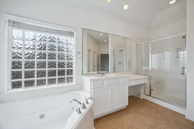 a bathroom with a bathtub sink and mirror
