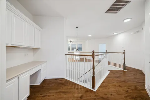 a view of a hallway with staircase