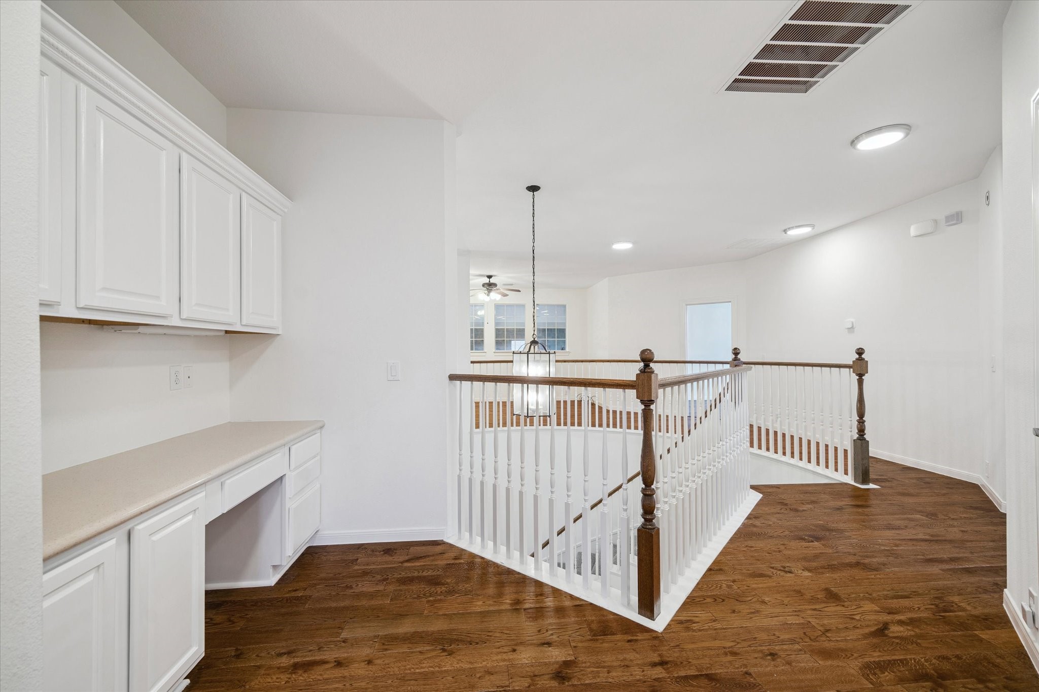 7211 Diamond Falls Lane Spring, TX 77389 - Photo 17 of 29 Built-in desk and cabinetry at the top of the stairs—ideal for homework or home office.