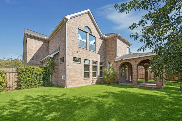 front view of a house with a tree