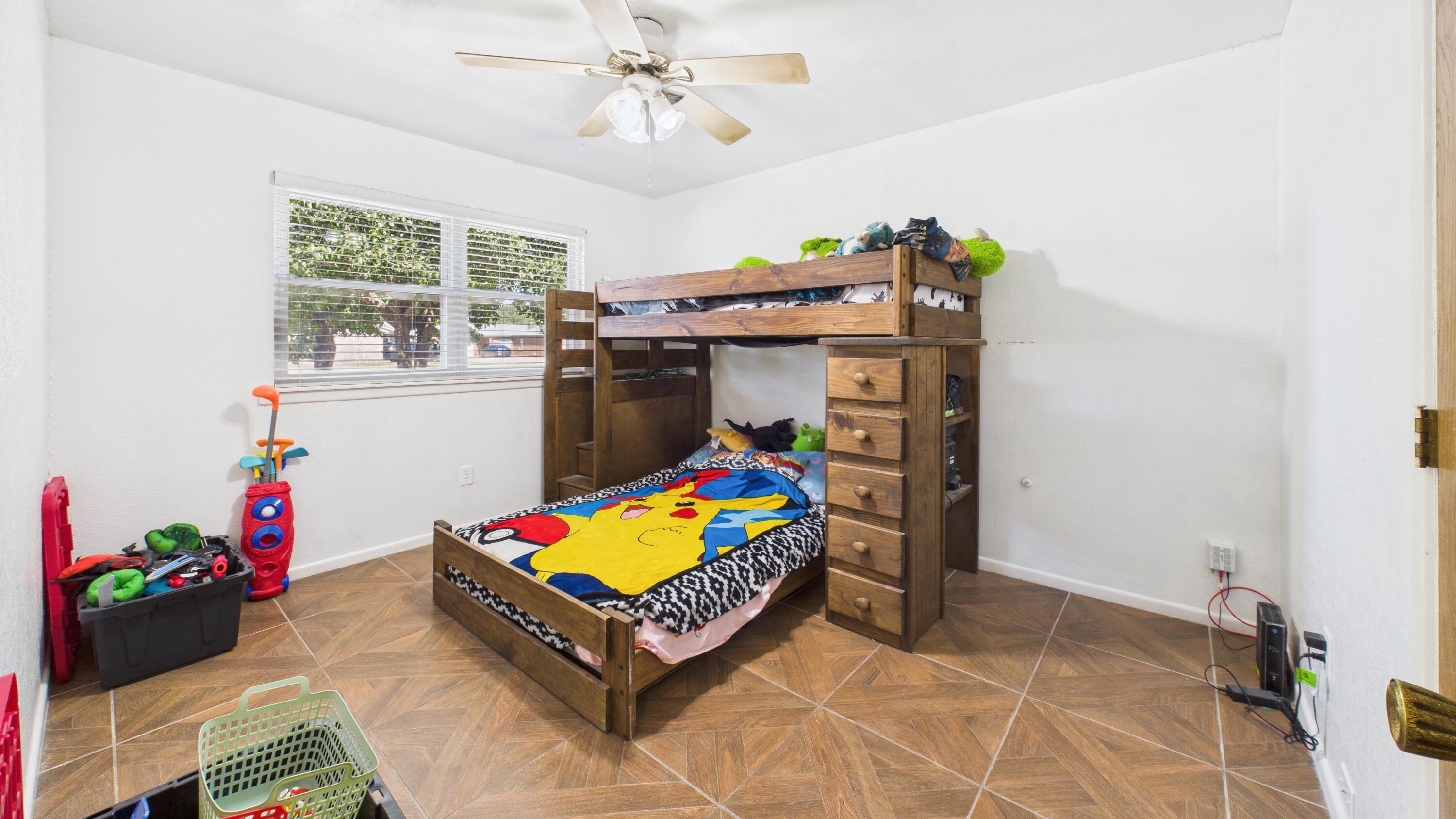 5431 34th Street Lubbock, TX 79407 - Photo 15 of 22 a living room with furniture and a dining table