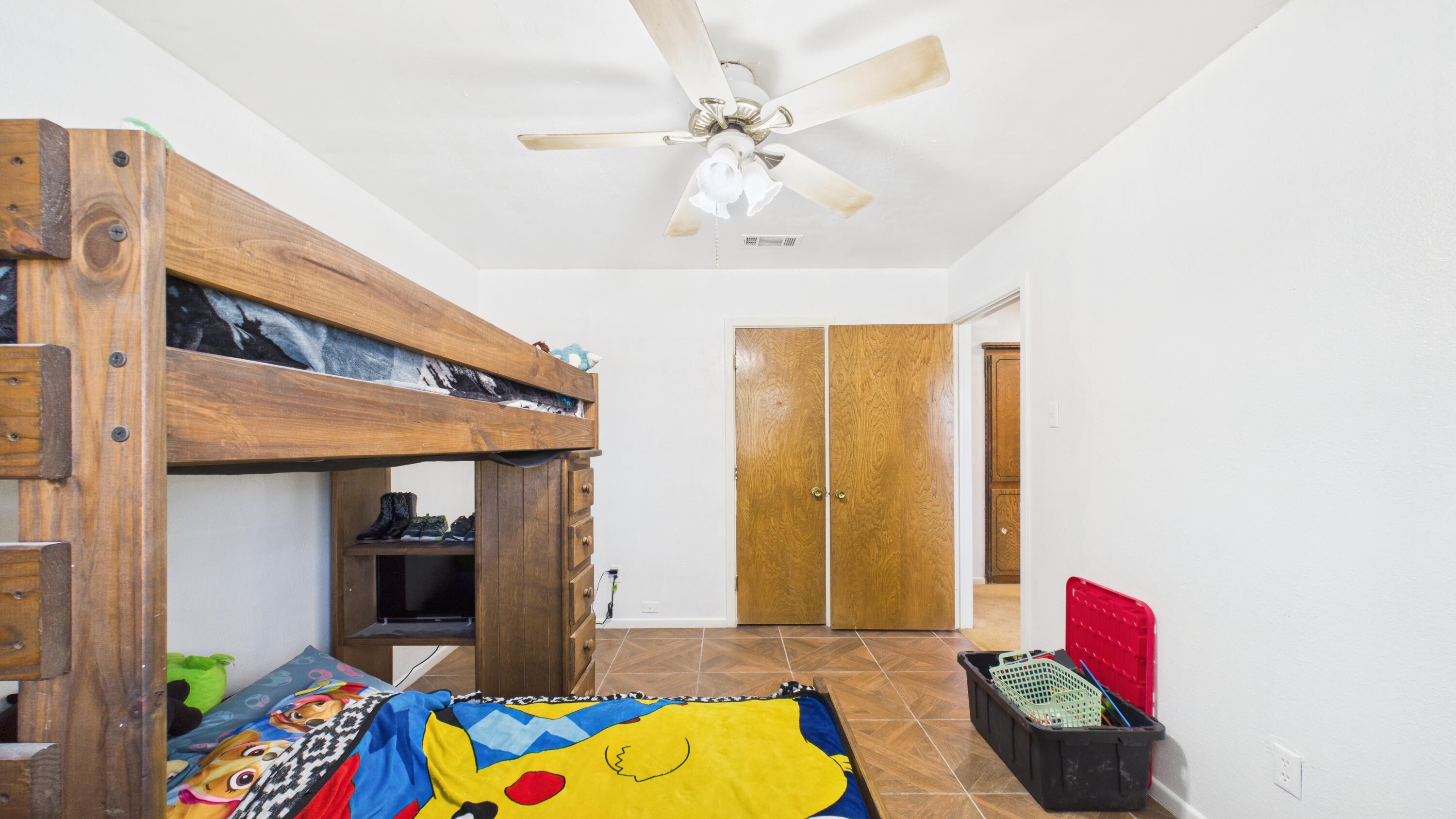 5431 34th Street Lubbock, TX 79407 - Photo 16 of 22 a living room with furniture and a rug