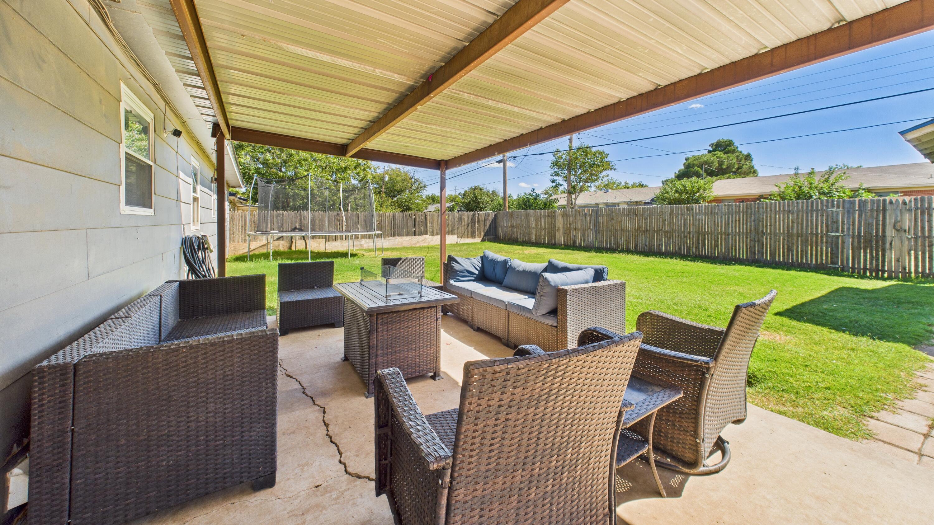 5431 34th Street Lubbock, TX 79407 - Photo 20 of 22 a view of an outdoor sitting area with furniture and garden
