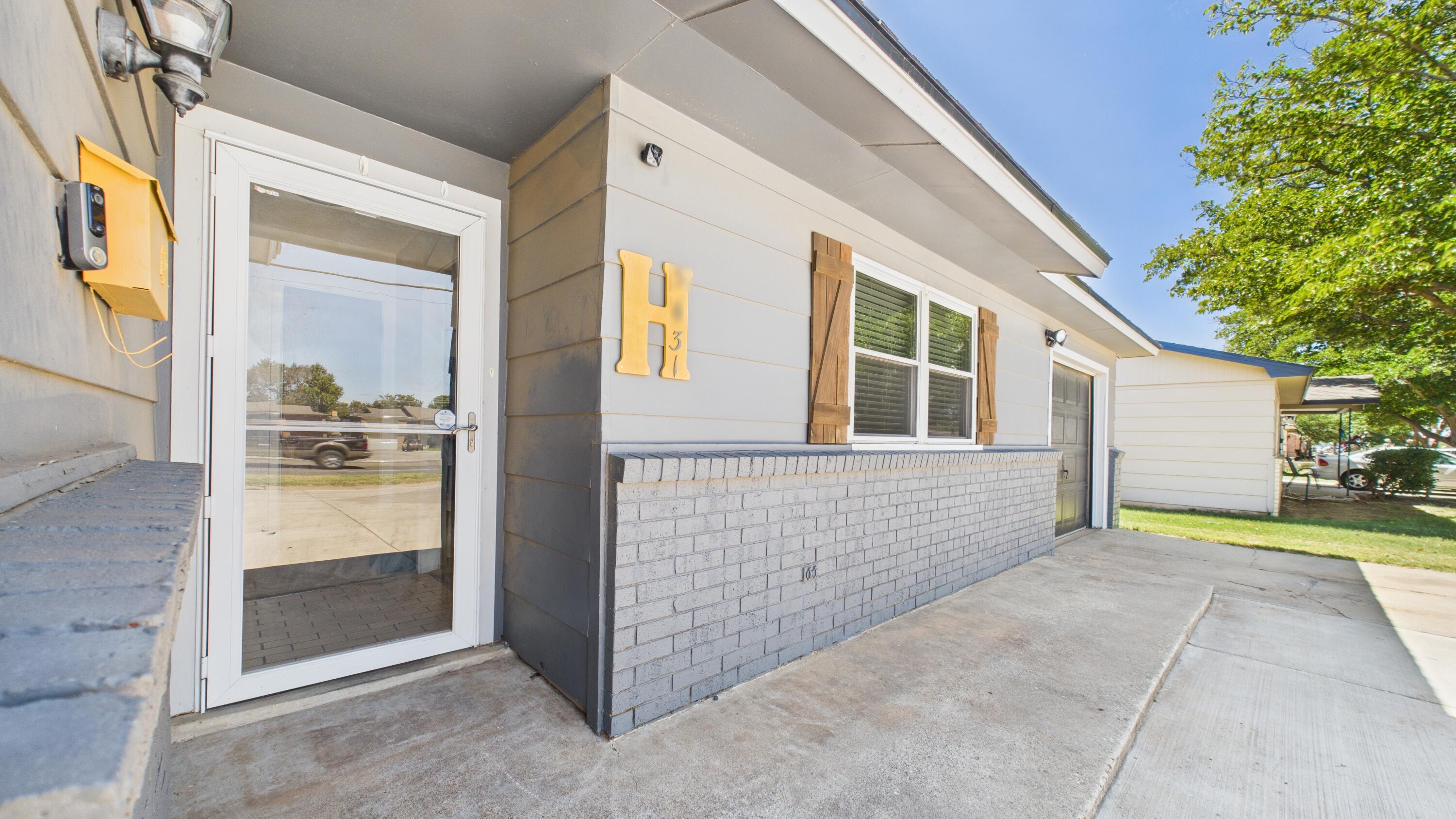 5431 34th Street Lubbock, TX 79407 - Photo 3 of 22 a view of front door of house and yard