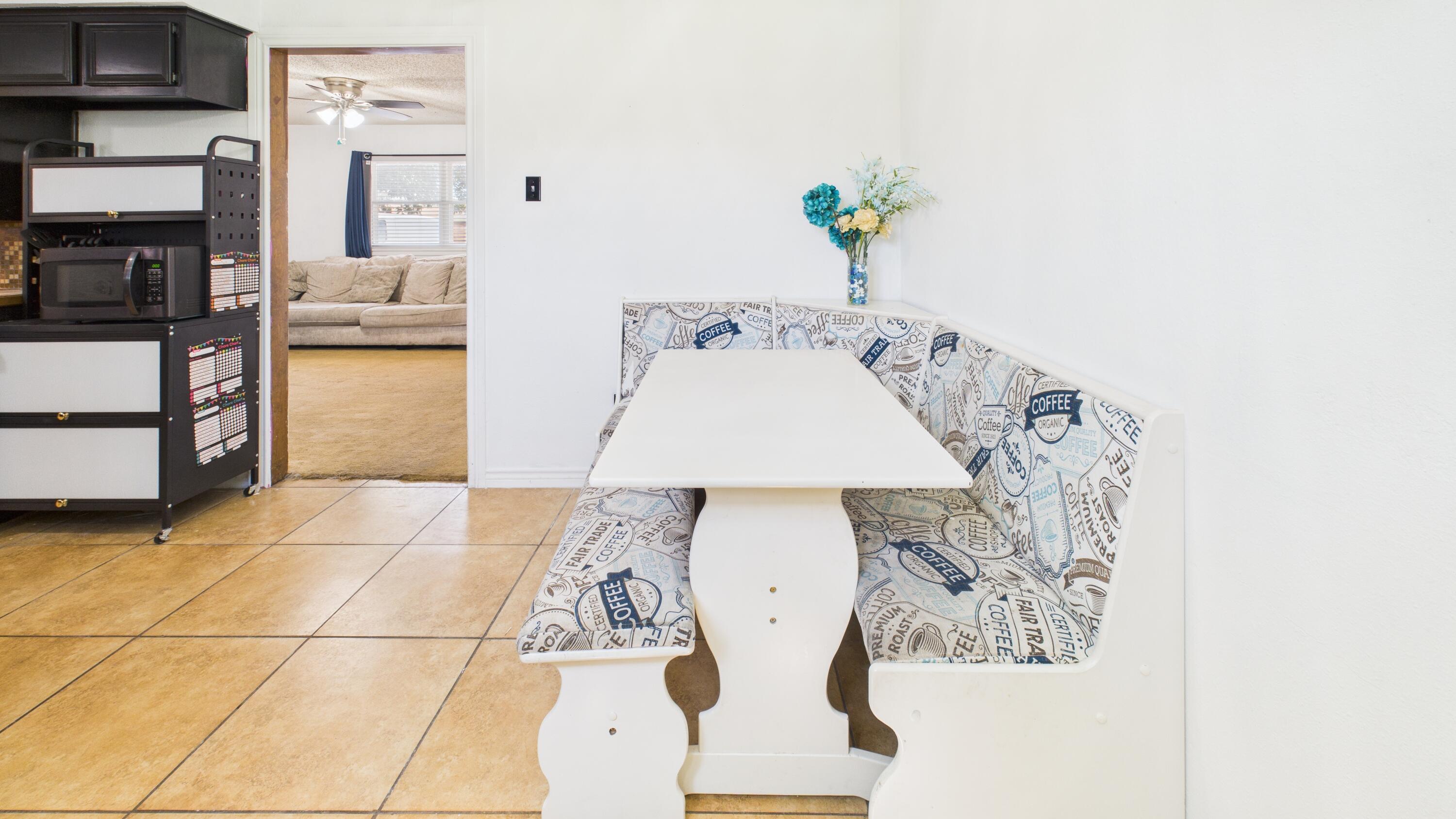 5431 34th Street Lubbock, TX 79407 - Photo 10 of 22 a picture of a living room with a baby crib
