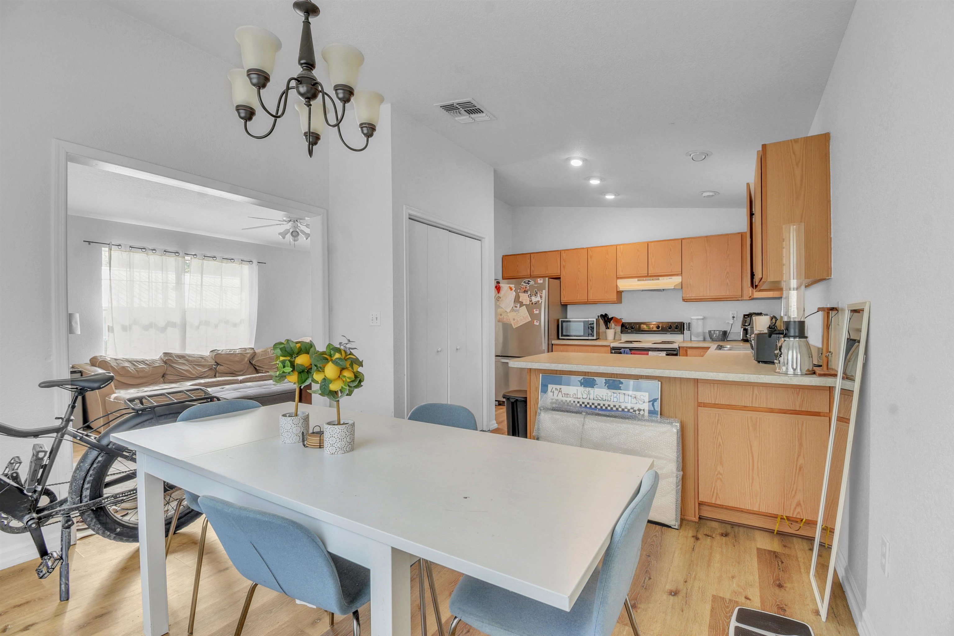 67 Anderson Street St. Augustine, FL 32084 - Photo 22 of 22 a kitchen with a table chairs sink and cabinets