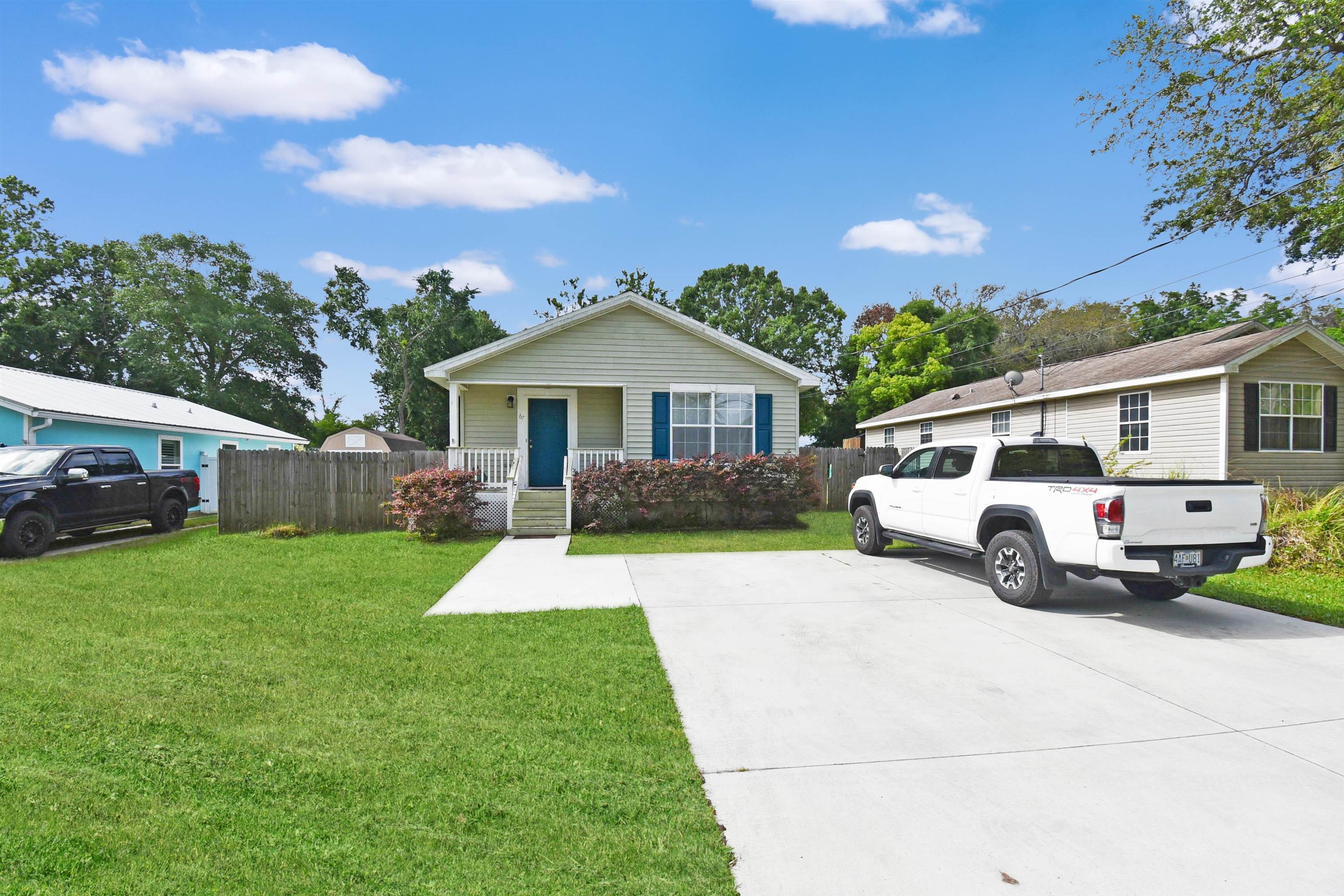 67 Anderson Street St. Augustine, FL 32084 - Photo 3 of 22 a front view of a house with a yard