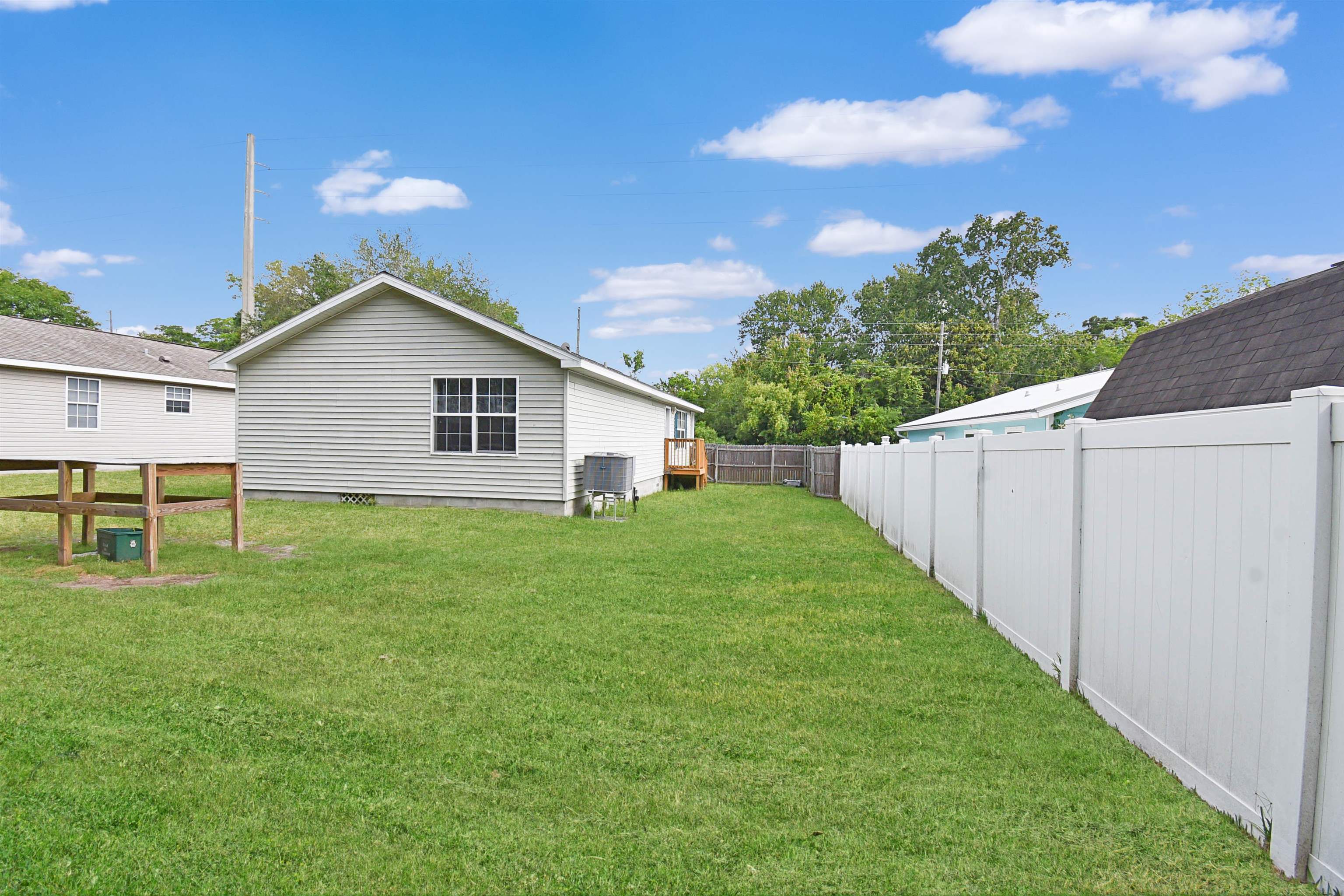 67 Anderson Street St. Augustine, FL 32084 - Photo 5 of 22 a view of a backyard with plants and a garden