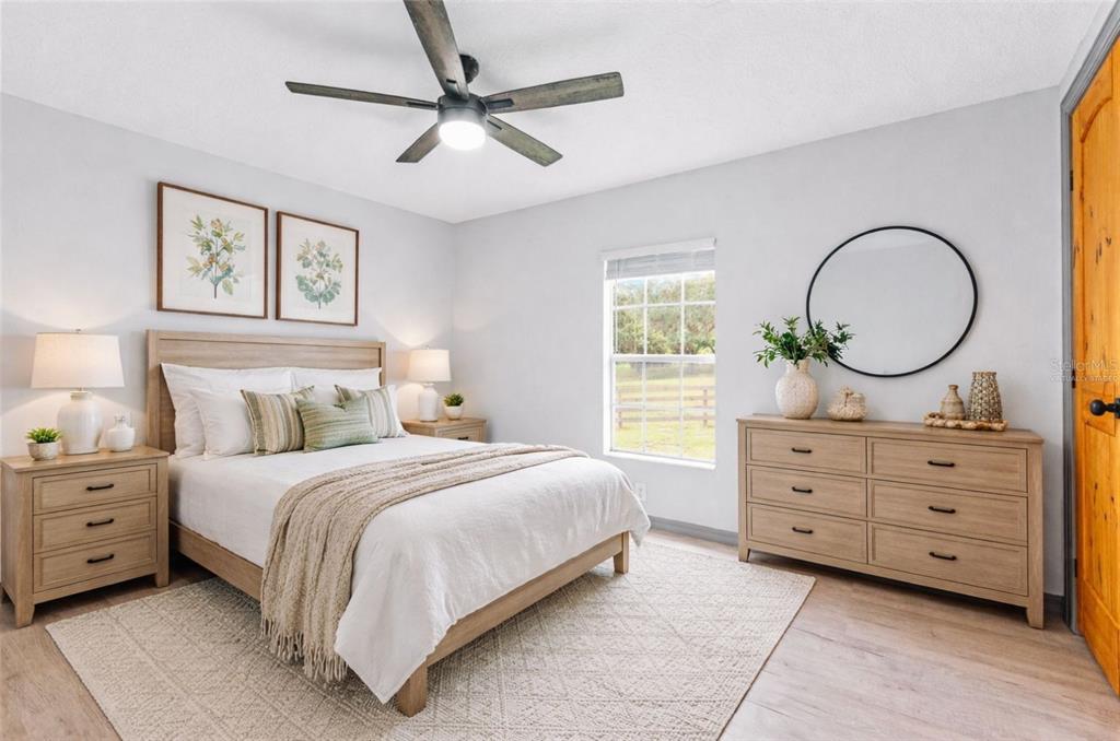 41534 Thomas Boat Landing Road Umatilla, FL 32784 - Photo 8 of 48 a bedroom with a bed and a dresser