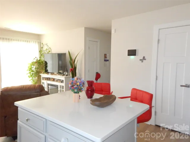 a room with furniture toys and a window