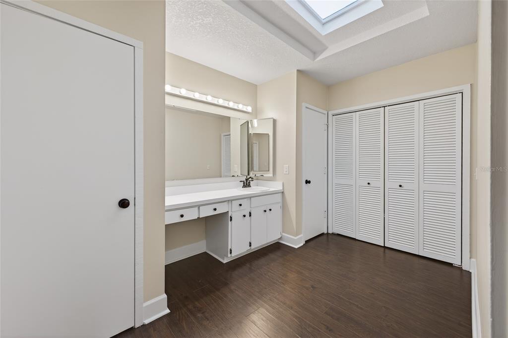 46 Nottingham Way Haines City, FL 33844 - Photo 11 of 18 a bathroom with a sink a mirror and a shower