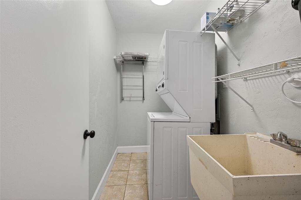 46 Nottingham Way Haines City, FL 33844 - Photo 16 of 18 a bathroom with a sink and shower