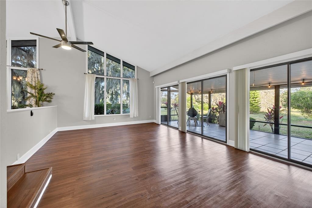46 Nottingham Way Haines City, FL 33844 - Photo 4 of 18 a view of empty room with wooden floor and fan