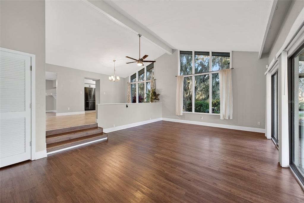 46 Nottingham Way Haines City, FL 33844 - Photo 5 of 18 wooden floor in an empty room with a window