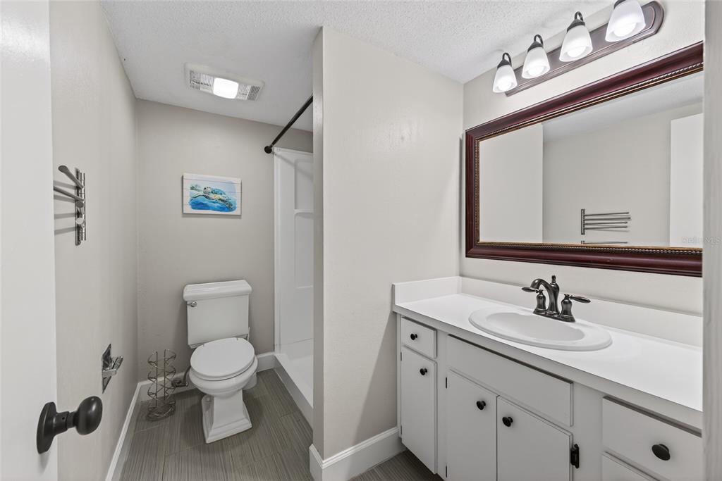 46 Nottingham Way Haines City, FL 33844 - Photo 10 of 18 a bathroom with a toilet sink and mirror