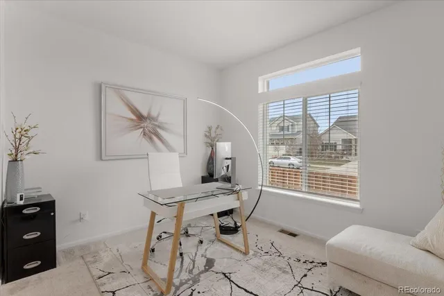 a workspace with furniture and a window