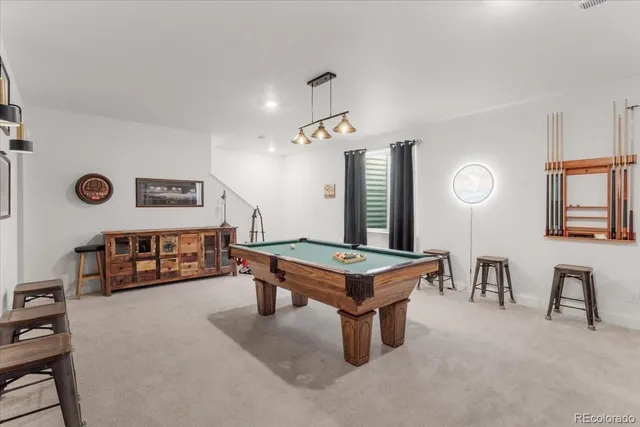 a living room with furniture and a table